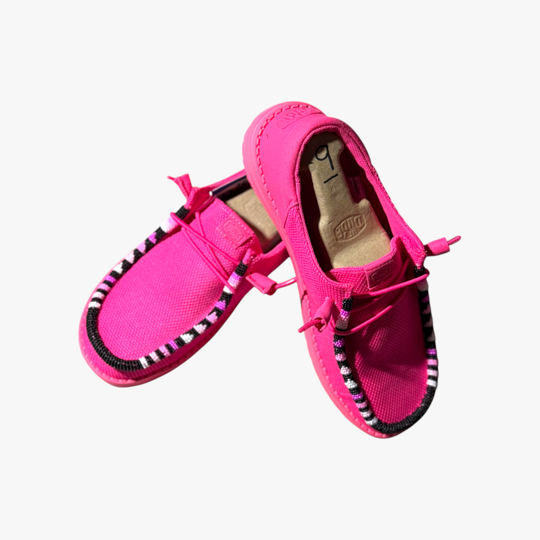 All Nations Designs &amp; More electric pink Hey Dude slip-on shoes featuring unique hand-beaded trim details.