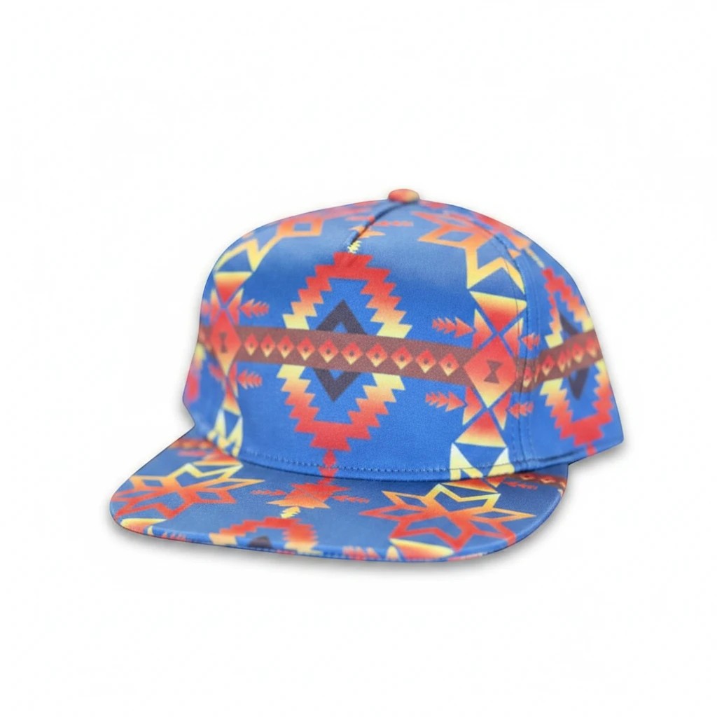 All Nations Designs &amp; More flat bill snapback hat with vibrant blue, red, and gold southwest geometric patterns.