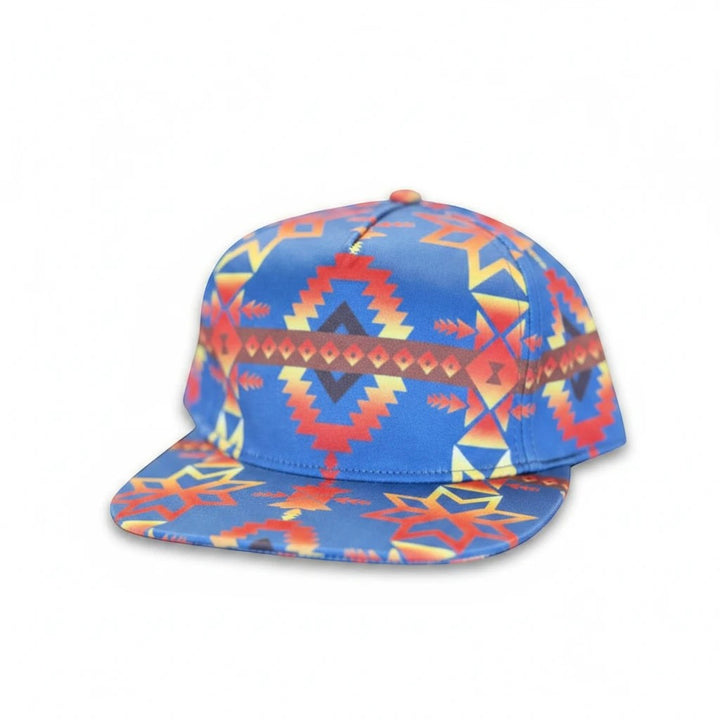 All Nations Designs &amp; More flat bill snapback hat with vibrant blue, red, and gold southwest geometric patterns.