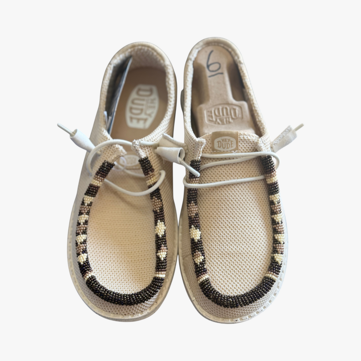 All Nations Designs & More women's tan mesh Hey Dude slip-on shoes with custom hand-beaded detailing in size 6
