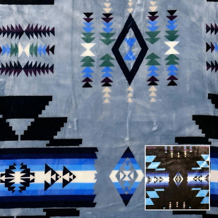 Aqua Southwestern-style plush blanket with bold Native-inspired geometric diamond and stripe patterns.