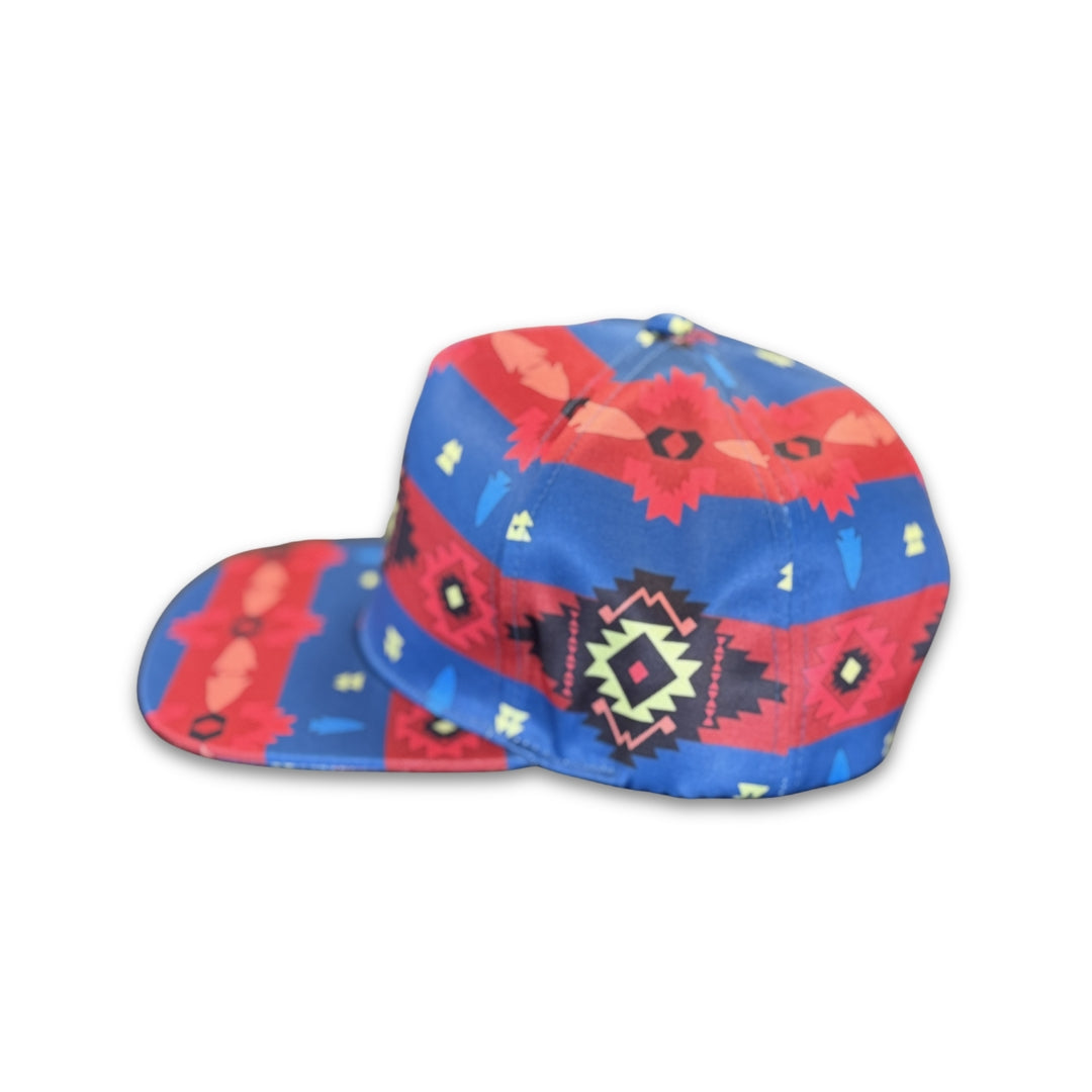 Side profile of Blue Canyon southwest flat bill snapback hat featuring blue geometric western-inspired design and flat brim.