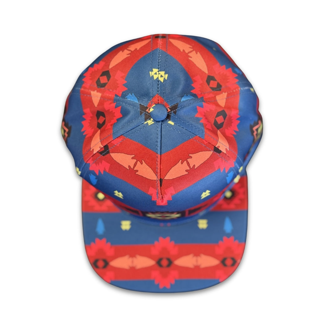 Top view of Blue Canyon southwest flat bill snapback hat featuring symmetrical blue and red geometric patterns.