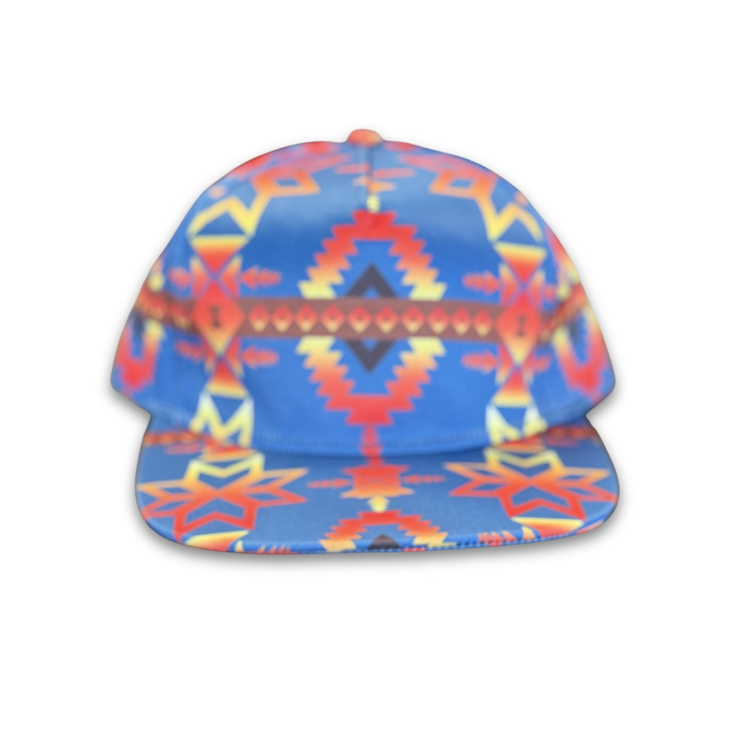 Canyon Sky southwest flat bill snapback hat featuring blue geometric western-inspired patterns shown from the front.
