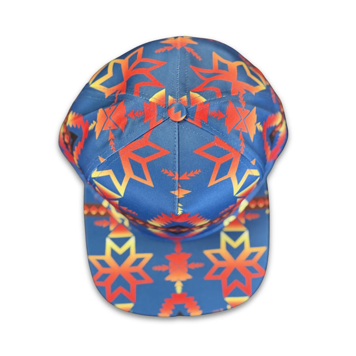 Top view of Canyon Sky southwest flat bill snapback hat with symmetrical blue and red geometric pattern details.