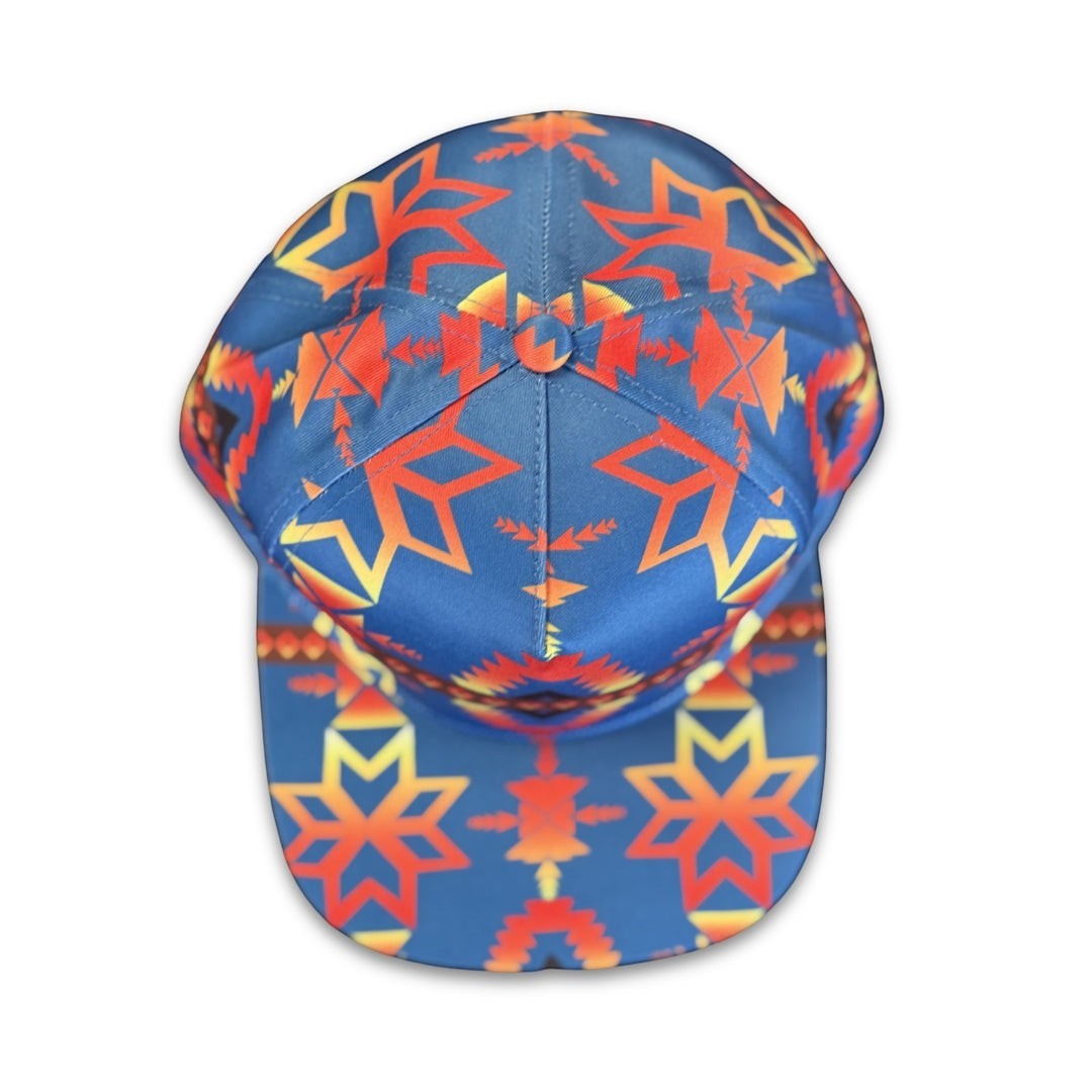 Top view of Canyon Sky southwest flat bill snapback hat with symmetrical blue and red geometric pattern details.