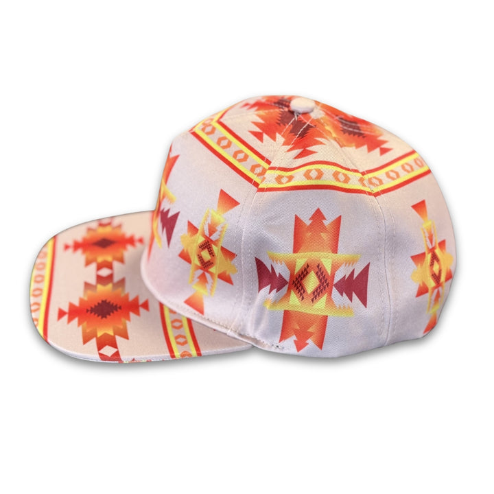 Angled side profile of white southwest flat brim snapback cap with structured fit and all-over geometric print.
