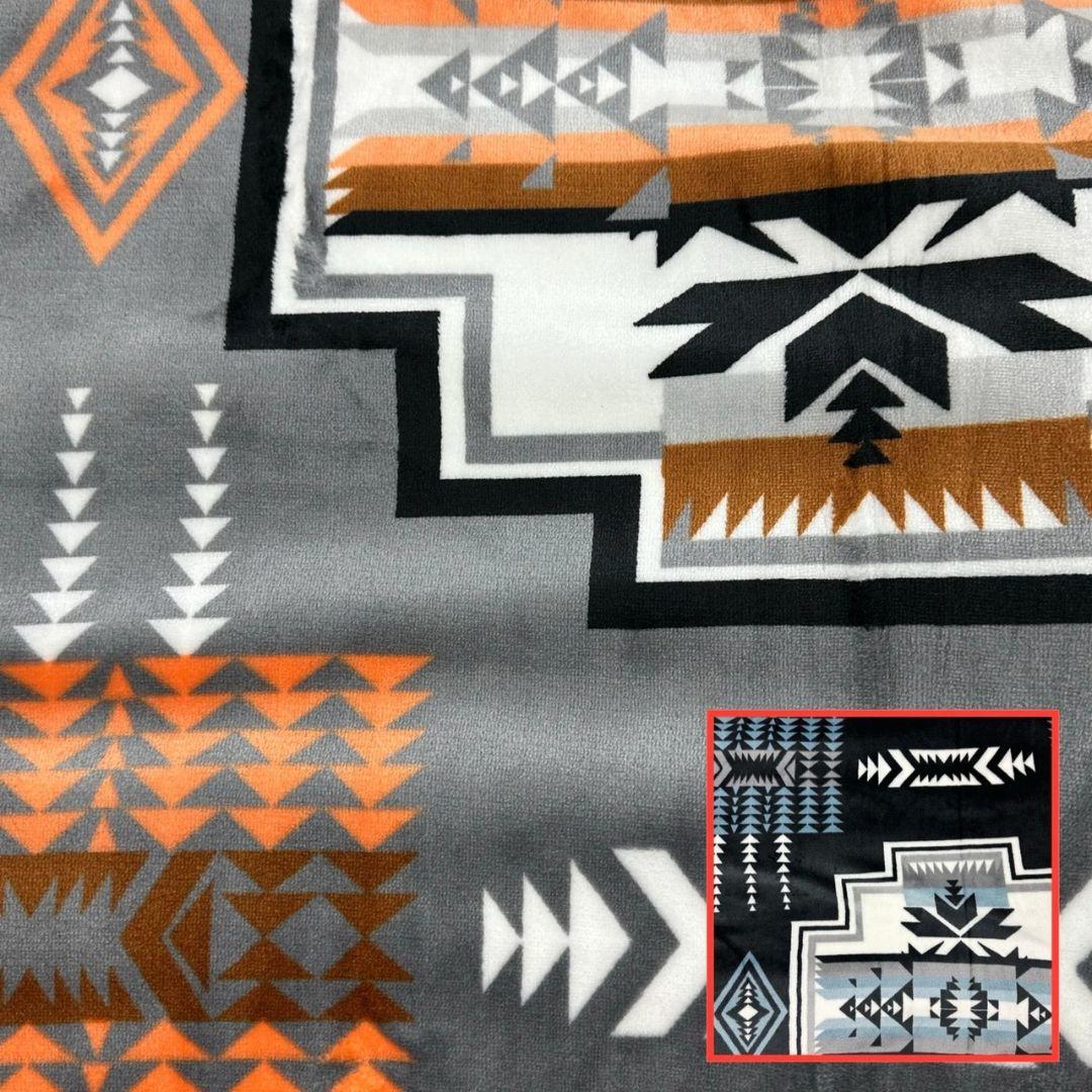 Gray Geo-Storm Reversible Native-Inspired Satin-Touch Blanket with vibrant Southwestern geometric designs.