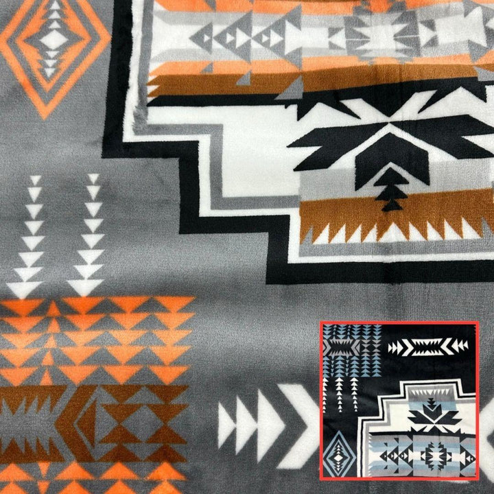 Gray Geo-Storm Reversible Native-Inspired Satin-Touch Blanket with vibrant Southwestern geometric designs.