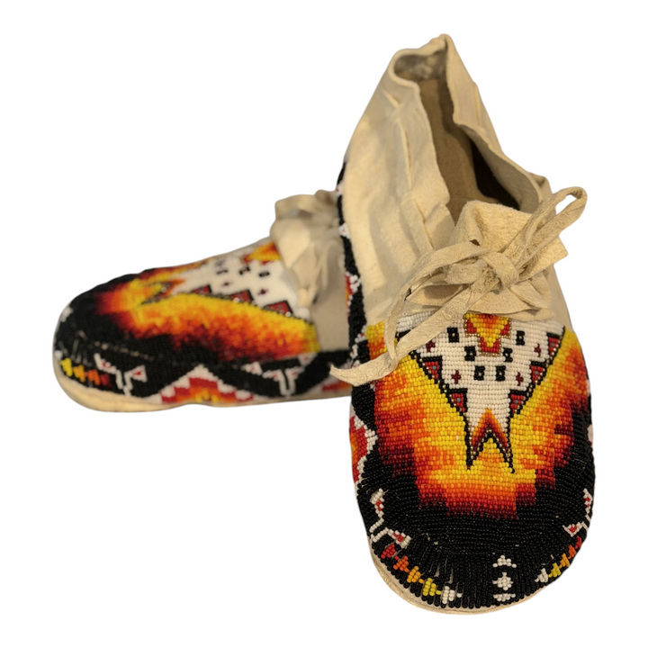 Angled view of the same size 9.5 hand-beaded moccasin pair