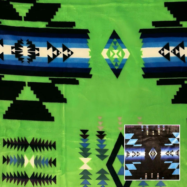Lime green Southwestern-style plush blanket with bold Native-inspired geometric diamond and stripe patterns.