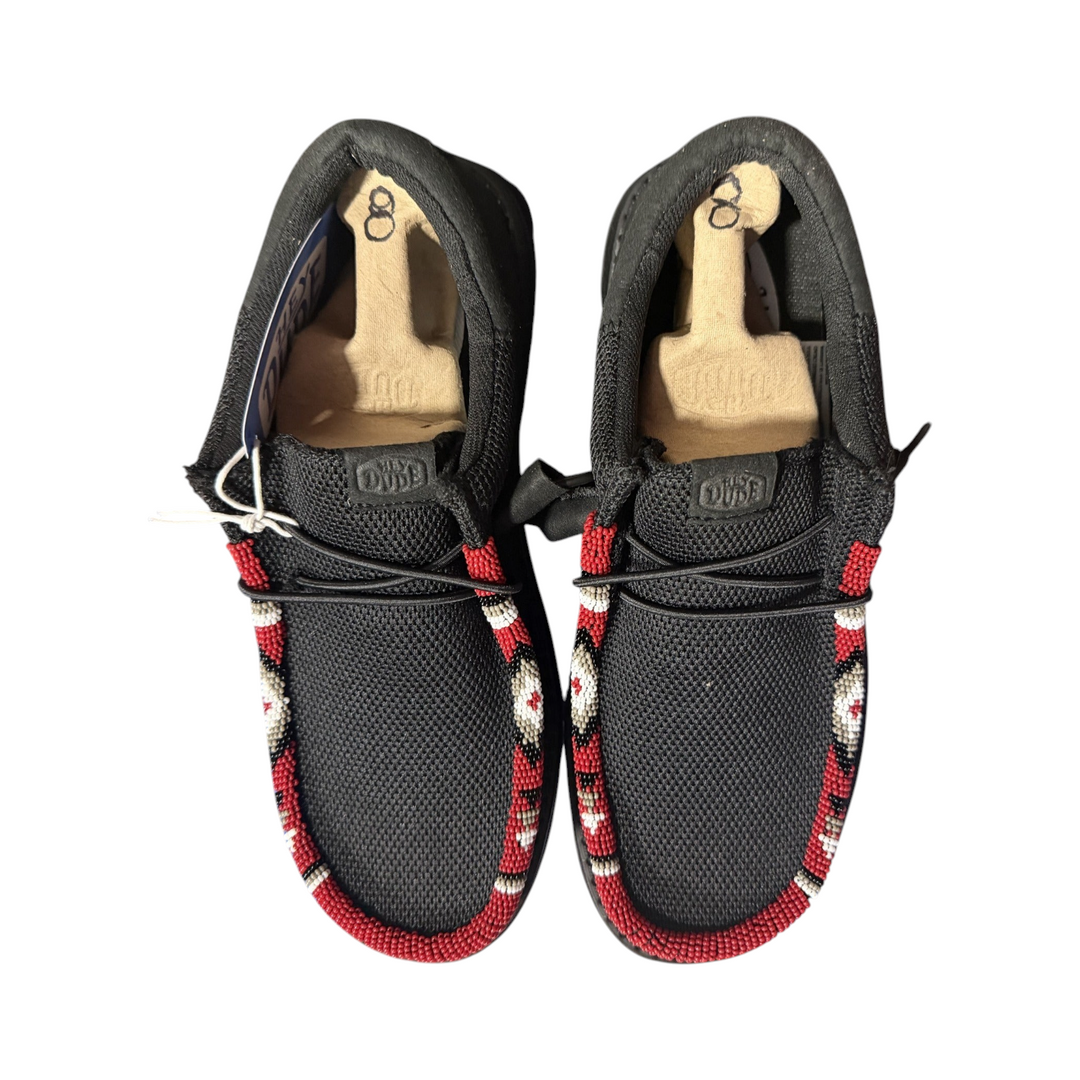 Detail of the red, white, tan and black hand-beaded trim on the exact men’s size 8 black Wally pair.