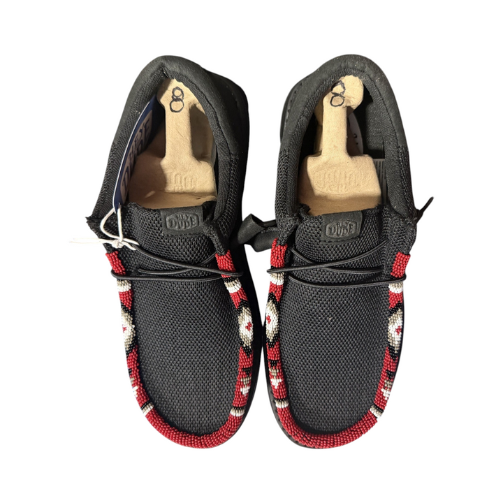 Detail of the red, white, tan and black hand-beaded trim on the exact men’s size 8 black Wally pair.