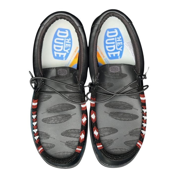 Men’s size 8 black leather Hey Dude Wally with laser-engraved feathers and black, red and white hand-beaded trim — overhead pair