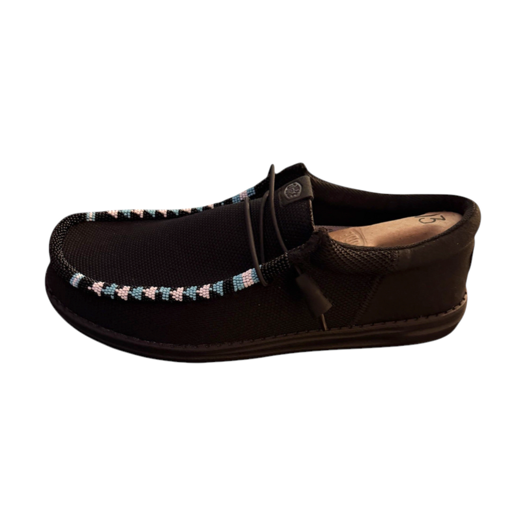 Side-detail view of the light blue, pale pink and black hand-beaded trim on the men’s size 13 black mesh Wally shoes.