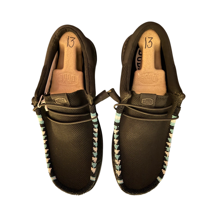 Top view of the one-of-one men’s size 13 black mesh Wally pair showing the beaded toe trim.