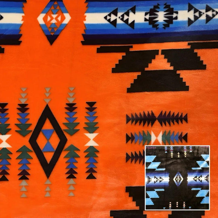 Orange Southwestern-style plush blanket with bold Native-inspired geometric diamond and stripe patterns.