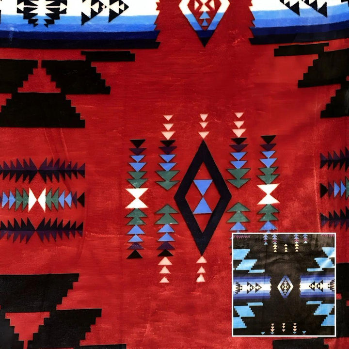 Red Southwestern-style plush blanket with bold Native-inspired geometric diamond and stripe patterns.