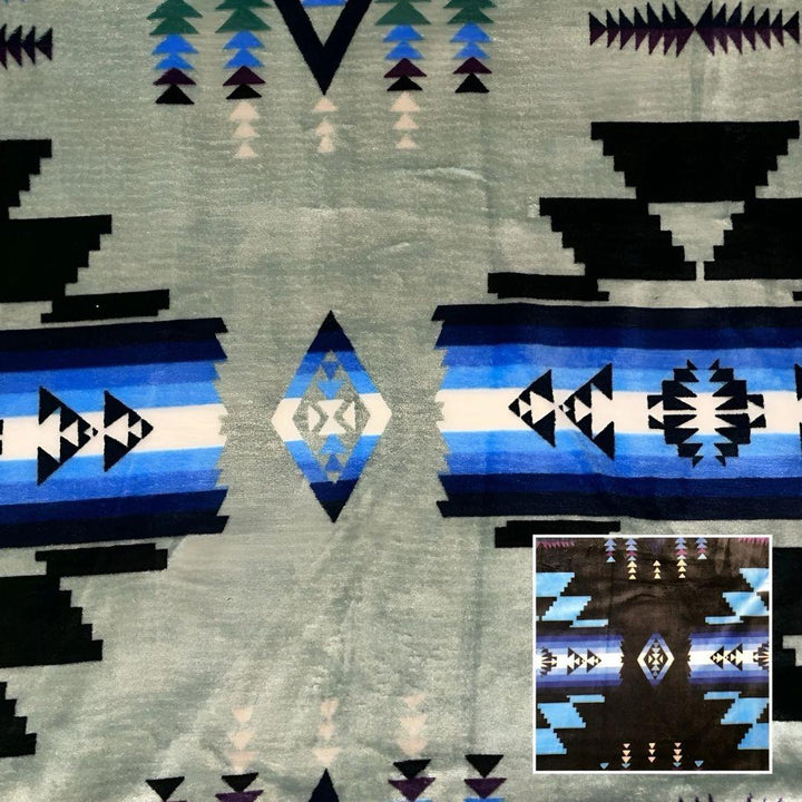 Sage Southwestern-style plush blanket with bold Native-inspired geometric diamond and stripe patterns.