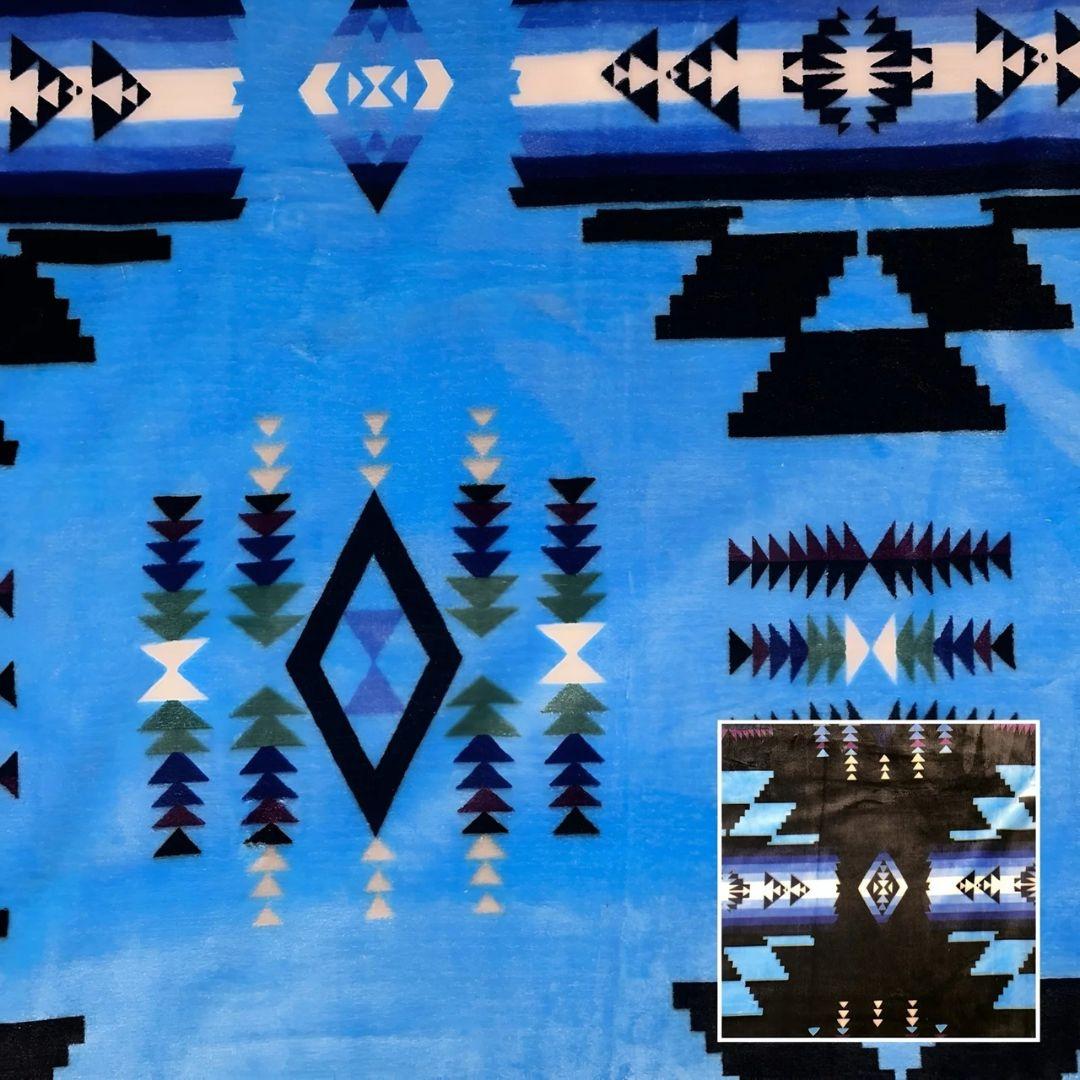 Sky blue Southwestern-style plush blanket with bold Native-inspired geometric diamond and stripe patterns.