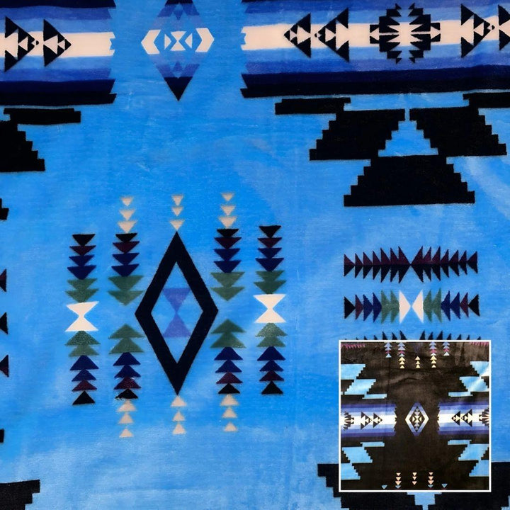 Sky blue Southwestern-style plush blanket with bold Native-inspired geometric diamond and stripe patterns.