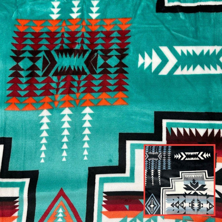Teal Geo-Storm Reversible Native-Inspired Satin-Touch Blanket with vibrant Southwestern geometric designs.