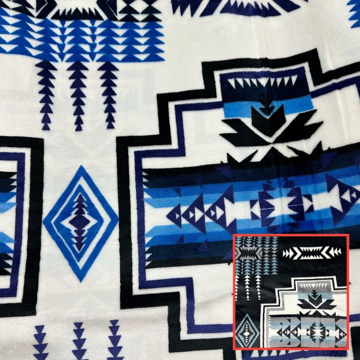 White Geo-Storm Reversible Native-Inspired Satin-Touch Blanket with vibrant Southwestern geometric designs.